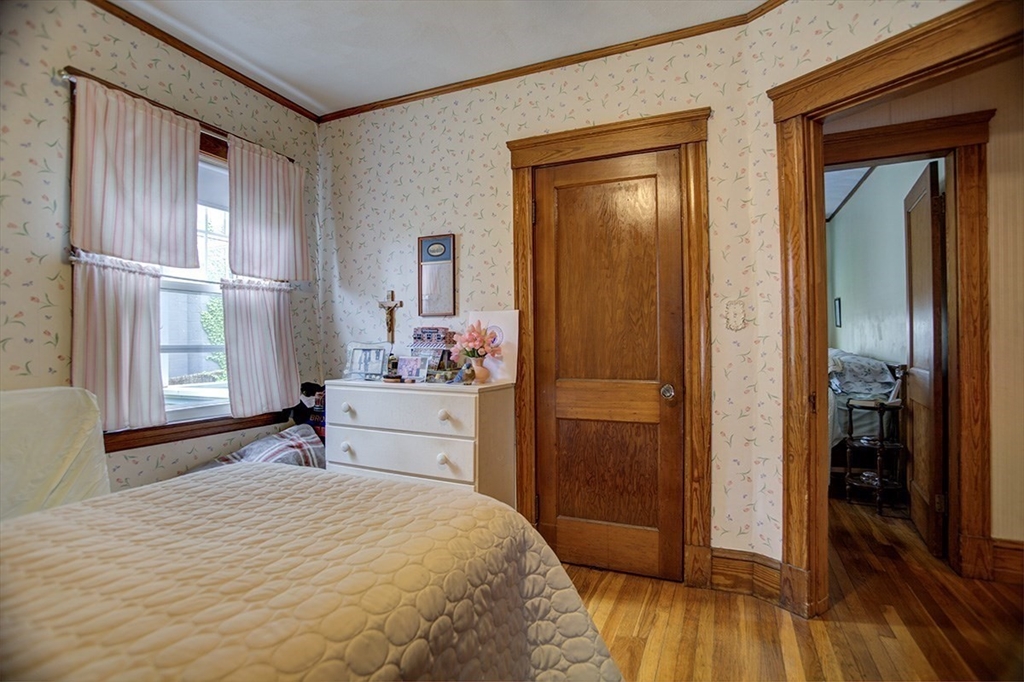 44 Cottage Park Road Winthrop, MA 02152 - Photo 31 of 39 a bedroom with a bed and a window