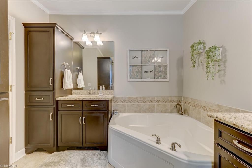 390 Dix Road Ruffin, NC 27326 - Photo 25 of 40 Granite countertops and double sinks with custom cabinets