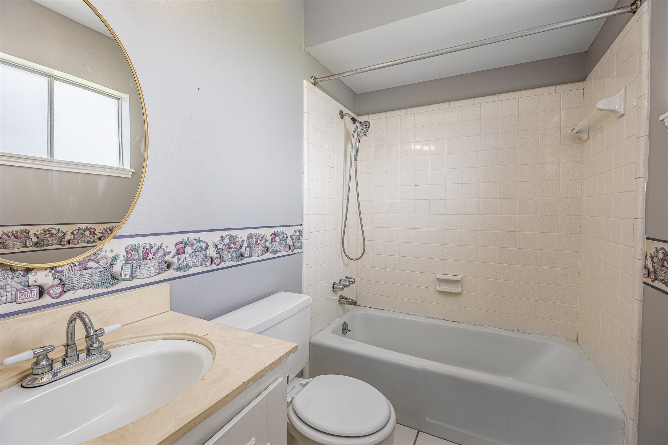 206 Kelly Lane Baytown, TX 77521 - Photo 23 of 38 The primary bathroom is freshly painted and has a shower/tub combo.
