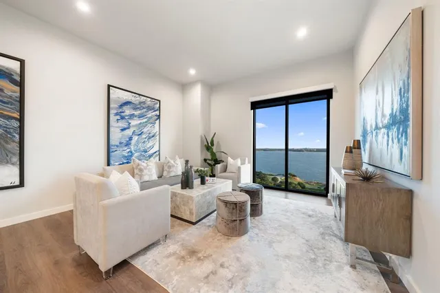 a bedroom with a large bed and a large window