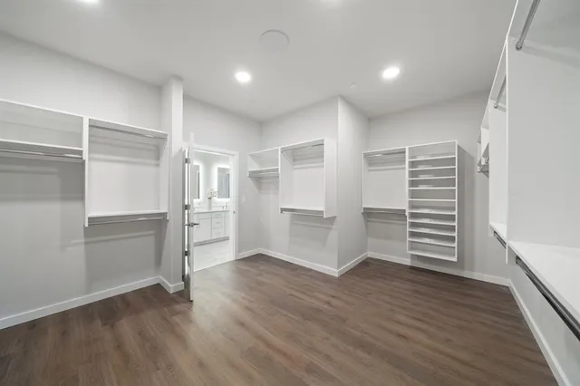 a bedroom with a large bed and a large window