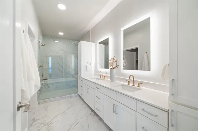 a living room with a couch and a painting on the wall