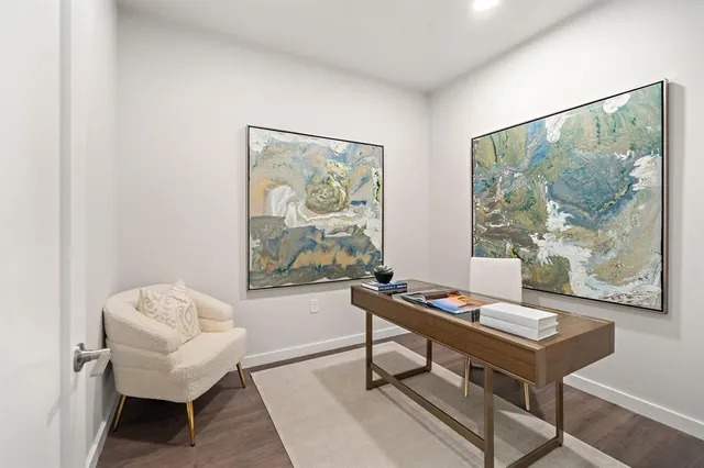 a bathroom with a sink a toilet and a window