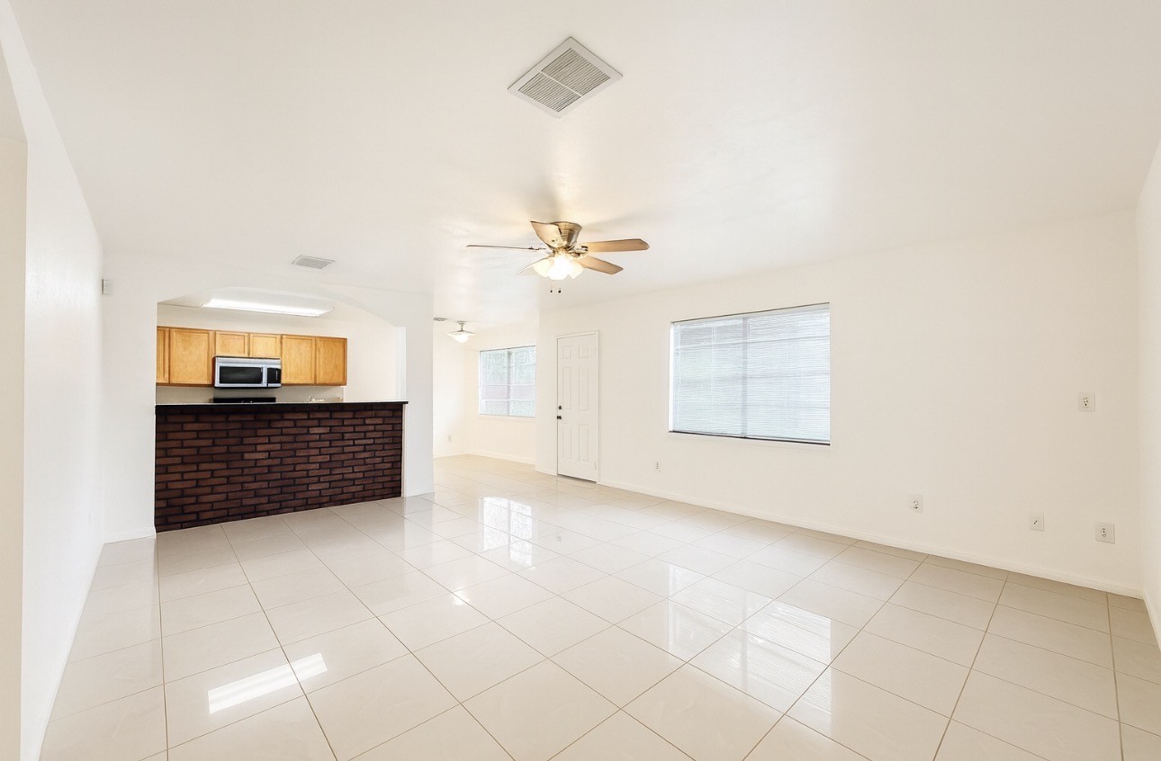 9811 Mango Street Houston, TX 77075 - Photo 4 of 14 an empty room with cabinet and mirrors