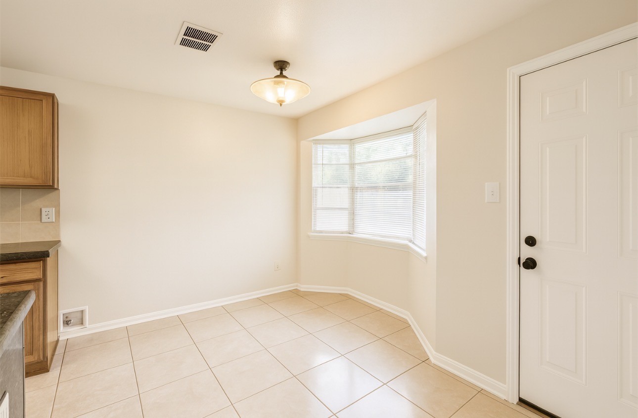 9811 Mango Street Houston, TX 77075 - Photo 5 of 14 a view of an empty room with a window