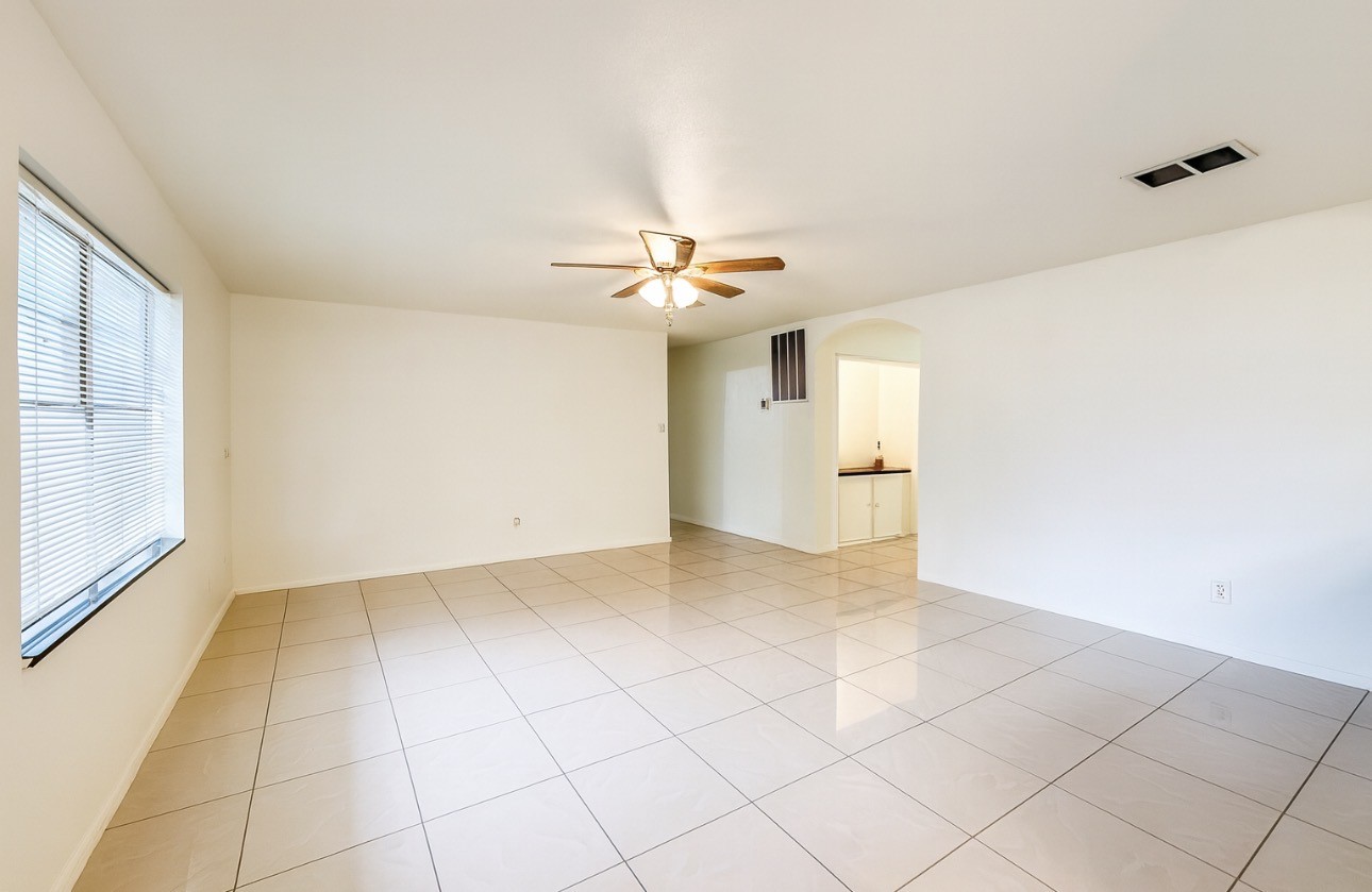 9811 Mango Street Houston, TX 77075 - Photo 7 of 14 a view of an empty room with a window