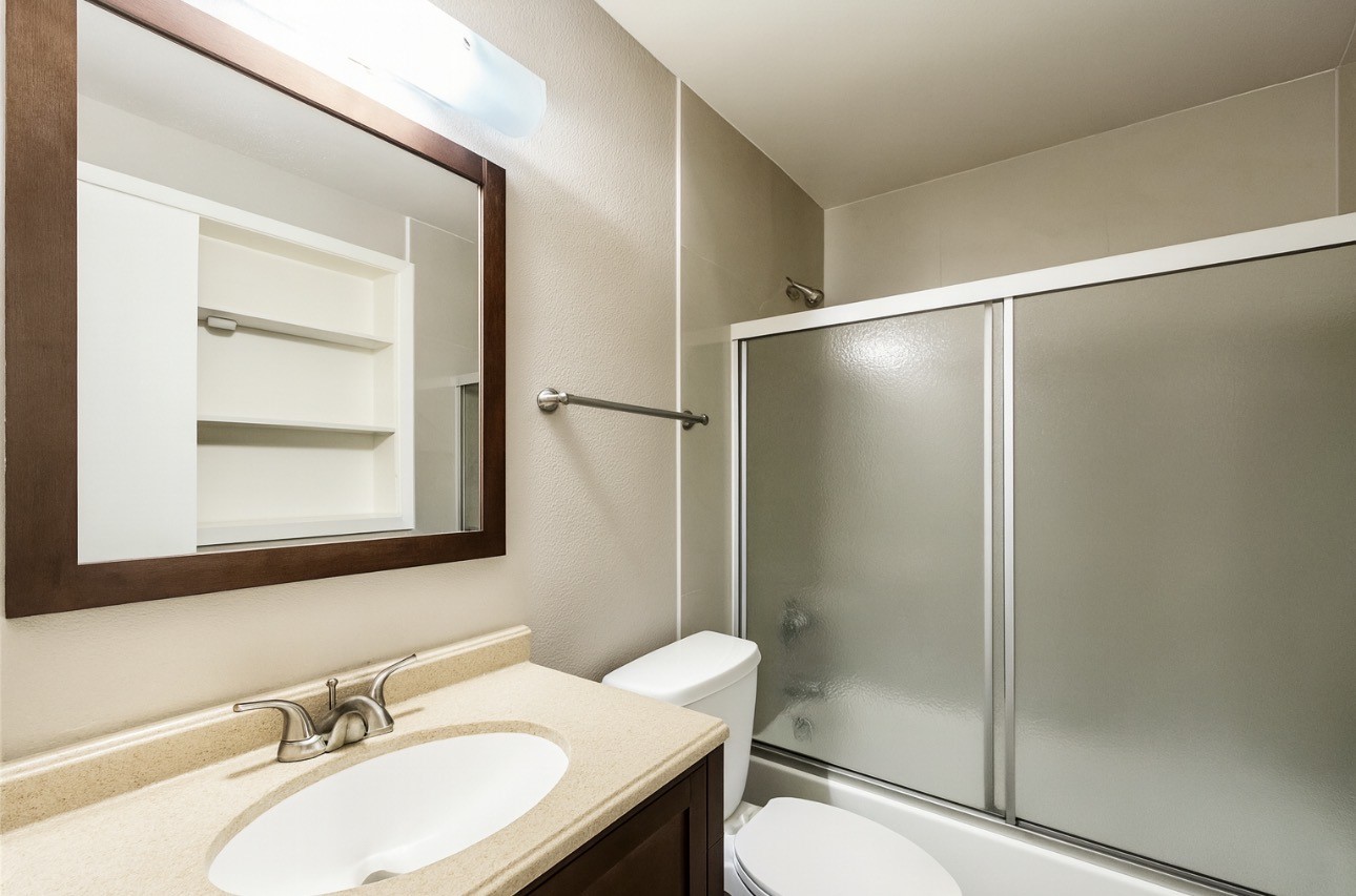 9811 Mango Street Houston, TX 77075 - Photo 9 of 14 a bathroom with a sink toilet and shower