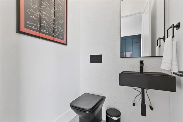 a bathroom with a toilet and a sink