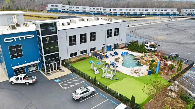 a view of a patio with table and chairs