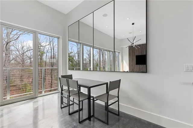 a dining room with furniture and window