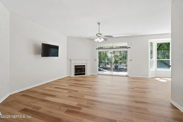 a view of a kitchen with a dishwasher cabinets and wooden floor