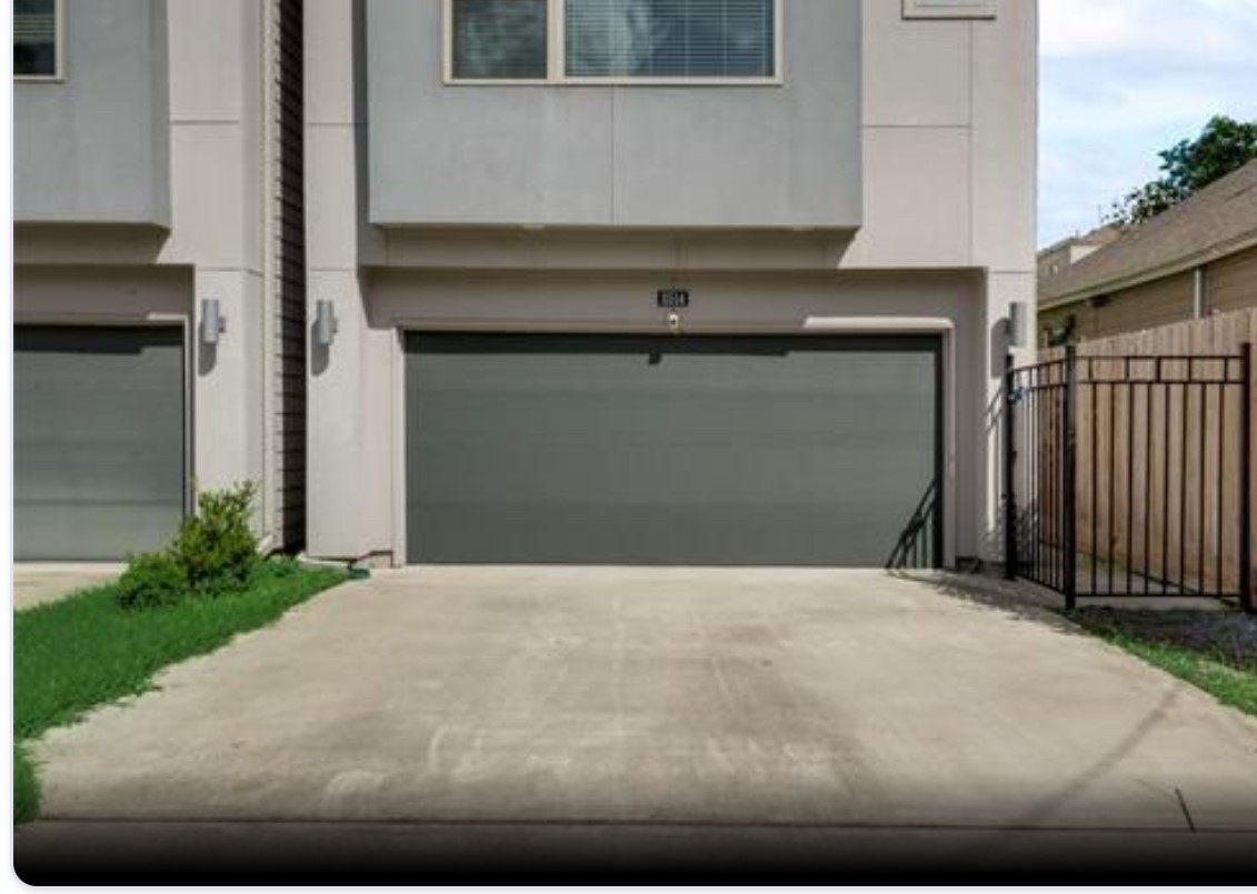 a front view of a house with garage