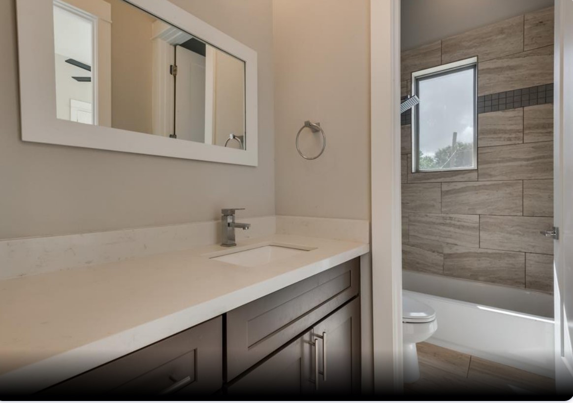 3514 Bastrop Street Houston, TX 77004 - Photo 4 of 11 a bathroom with a sink and a mirror
