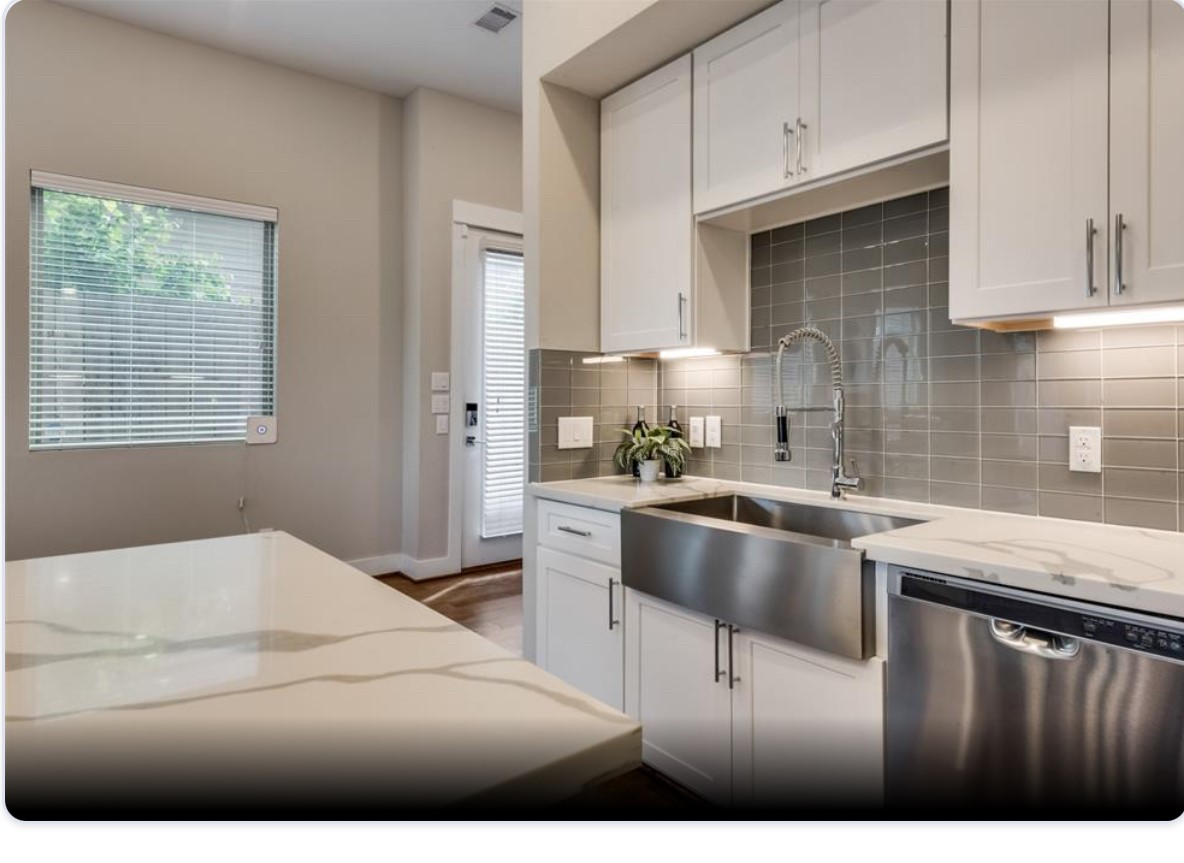 3514 Bastrop Street Houston, TX 77004 - Photo 5 of 11 a kitchen with stainless steel appliances granite countertop a stove a sink dishwasher and cabinets with wooden floor