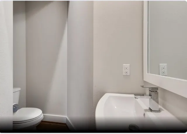 a bathroom with a sink and a toilet