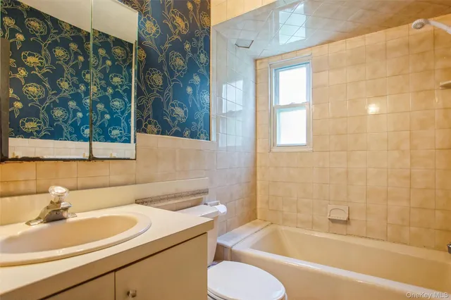 a bathroom with a sink toilet and bathtub