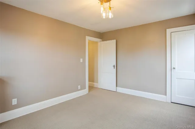 an empty room with a empty space and a ceiling fan