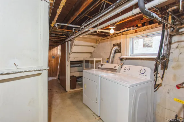 a view of storage and utility room with washer and dryer