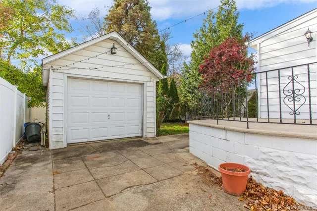 a front view of a house with garage