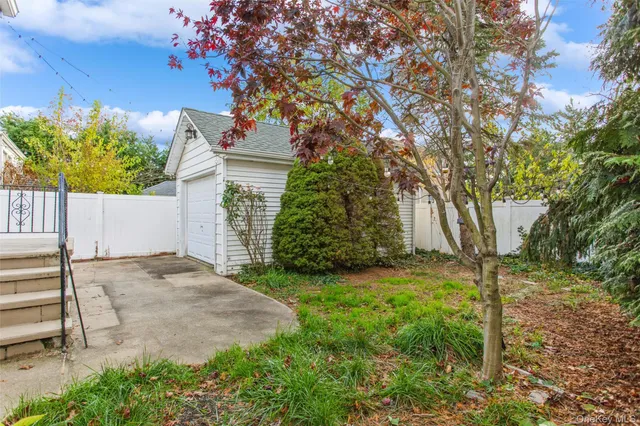 a view of a house with a tree