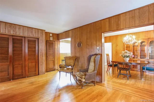 a view of a livingroom with furniture and floor to ceiling window