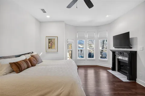 a living room with a fireplace and a flat screen tv