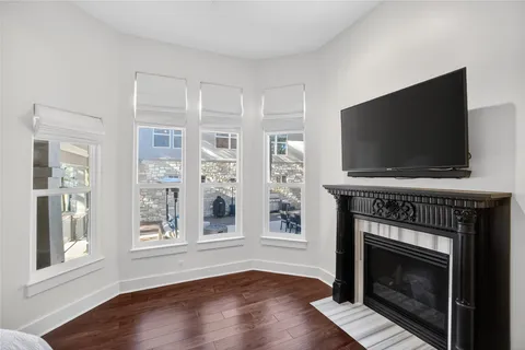 a spacious bathroom with a granite countertop sink mirror and bathtub