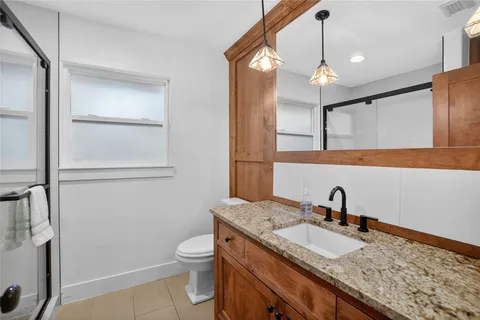 a view of a house with snow and trees