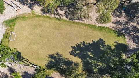 a bedroom with a large bed and a flat screen tv