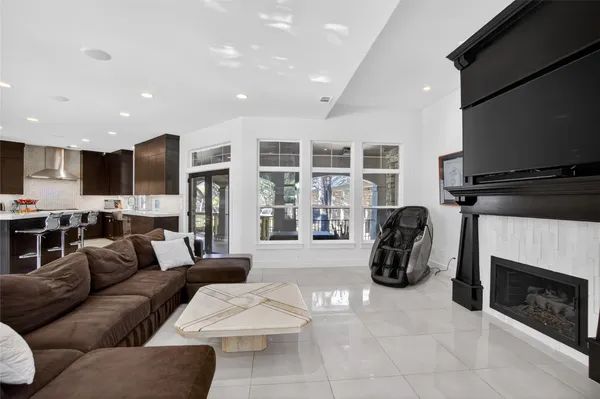 a kitchen with stainless steel appliances granite countertop a sink and a stove
