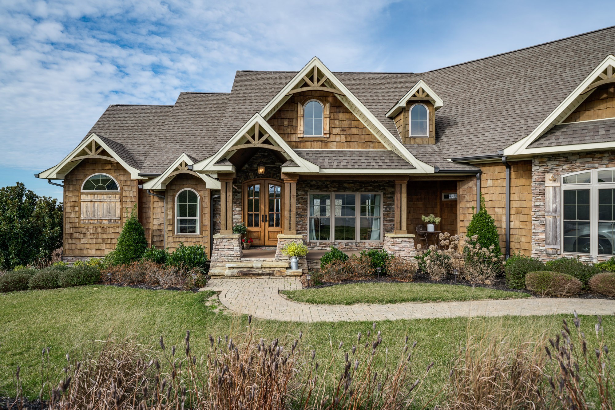 3639 Swan Ridge Road Celina, TN 38551 - Photo 15 of 37 a front view of a house with garden and porch