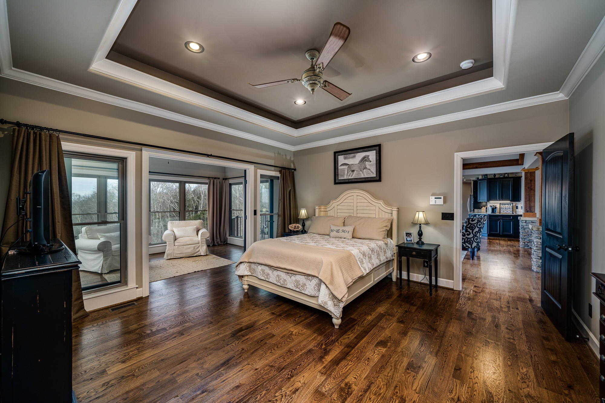 3639 Swan Ridge Road Celina, TN 38551 - Photo 21 of 37 a spacious bedroom with a large bed a flat tv screen and dresser