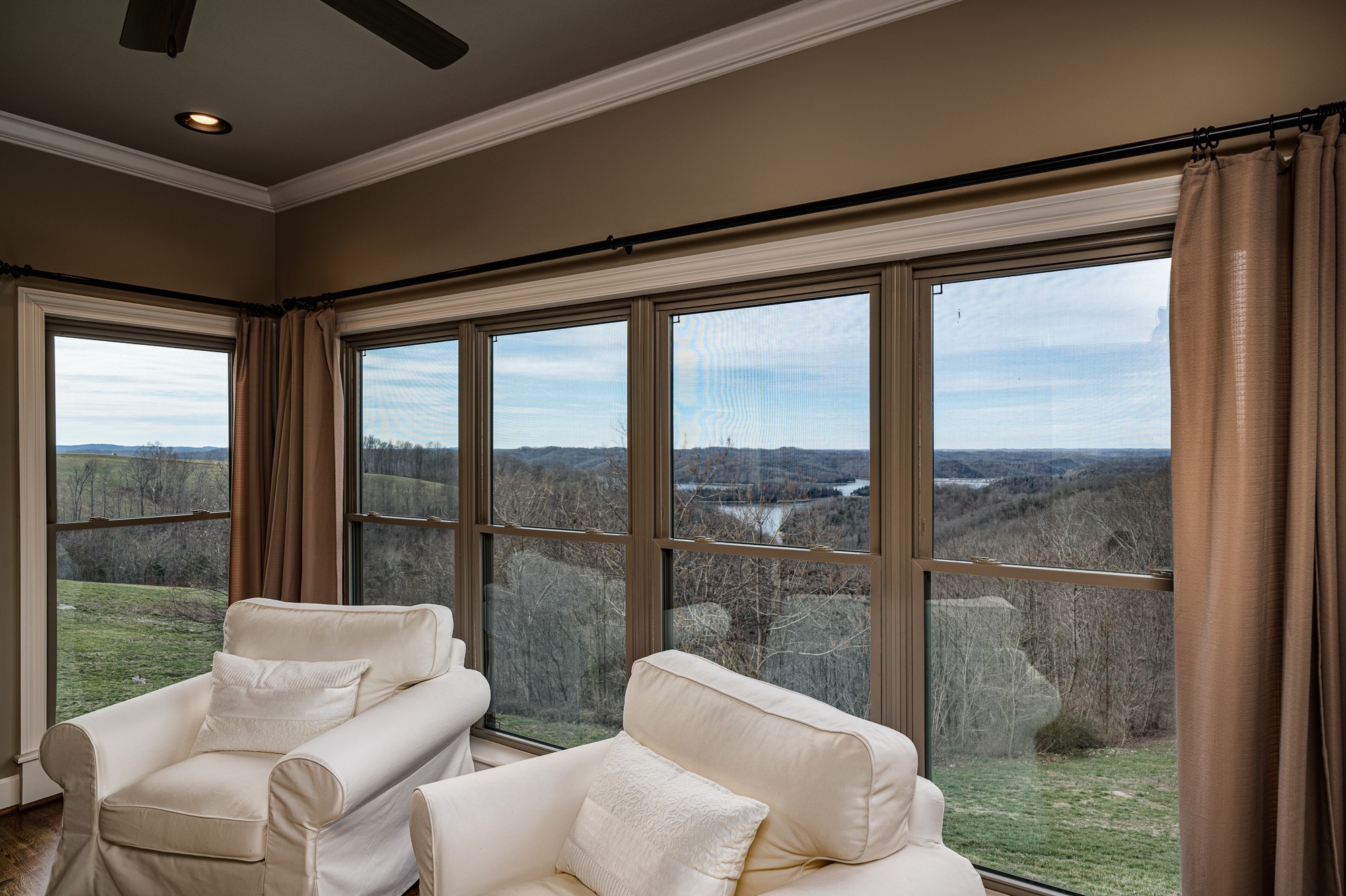 3639 Swan Ridge Road Celina, TN 38551 - Photo 22 of 37 a living room with furniture and a floor to ceiling window