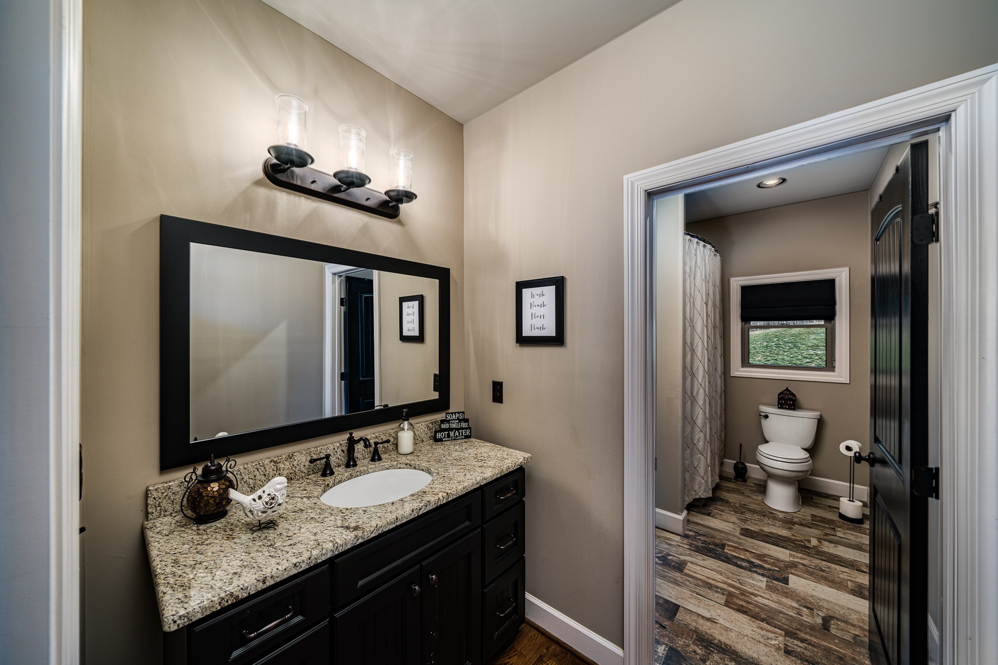 3639 Swan Ridge Road Celina, TN 38551 - Photo 27 of 37 a en suite bathroom with a granite countertop sink and a mirror