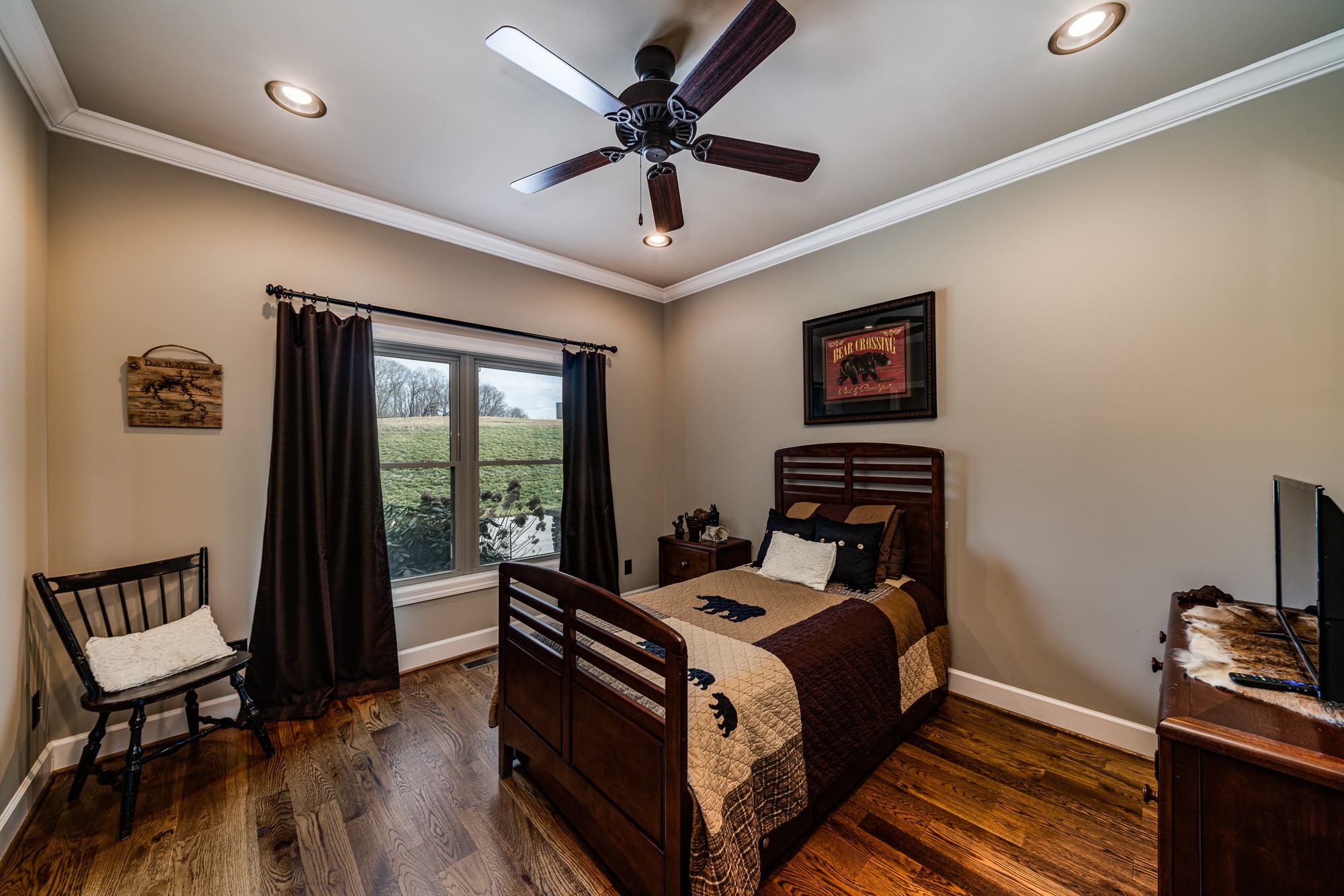 3639 Swan Ridge Road Celina, TN 38551 - Photo 28 of 37 a bed room with a bed and a chair