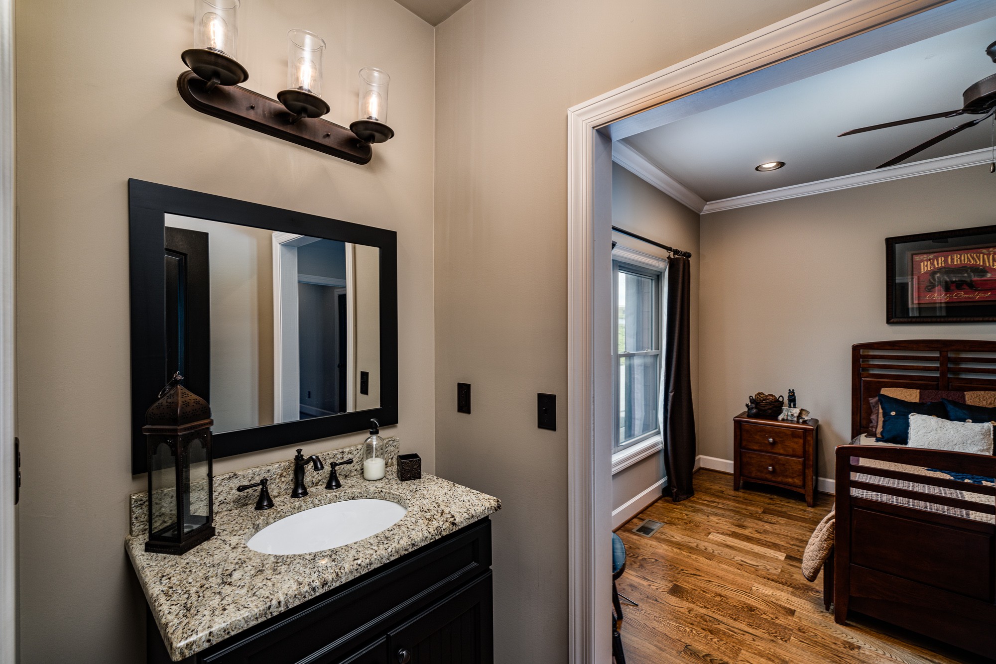 3639 Swan Ridge Road Celina, TN 38551 - Photo 29 of 37 a en suite bathroom with a granite countertop sink and a mirror