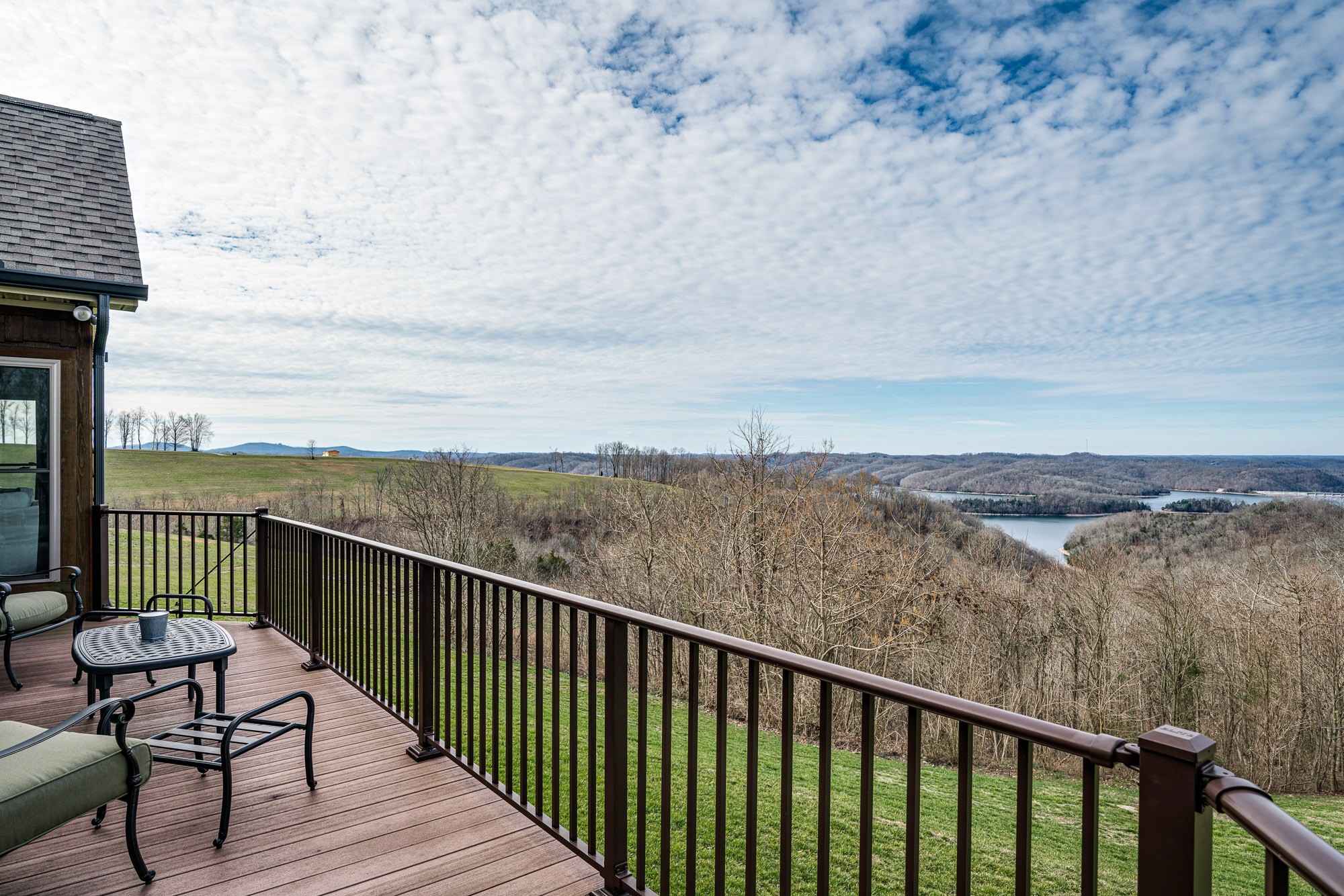 3639 Swan Ridge Road Celina, TN 38551 - Photo 35 of 37 a balcony with wooden floor and city view