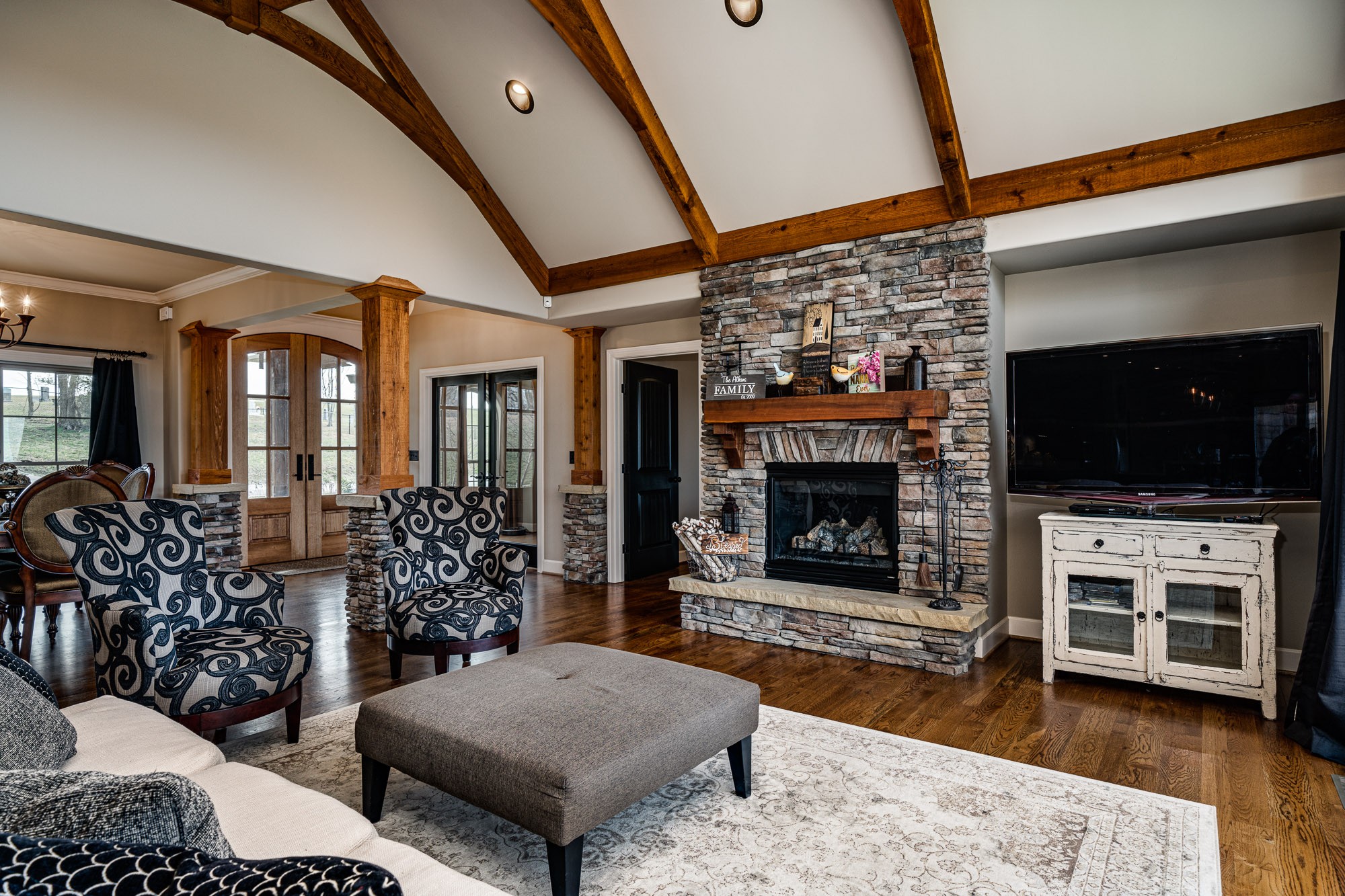 3639 Swan Ridge Road Celina, TN 38551 - Photo 5 of 37 a living room with furniture a flat screen tv and a fireplace