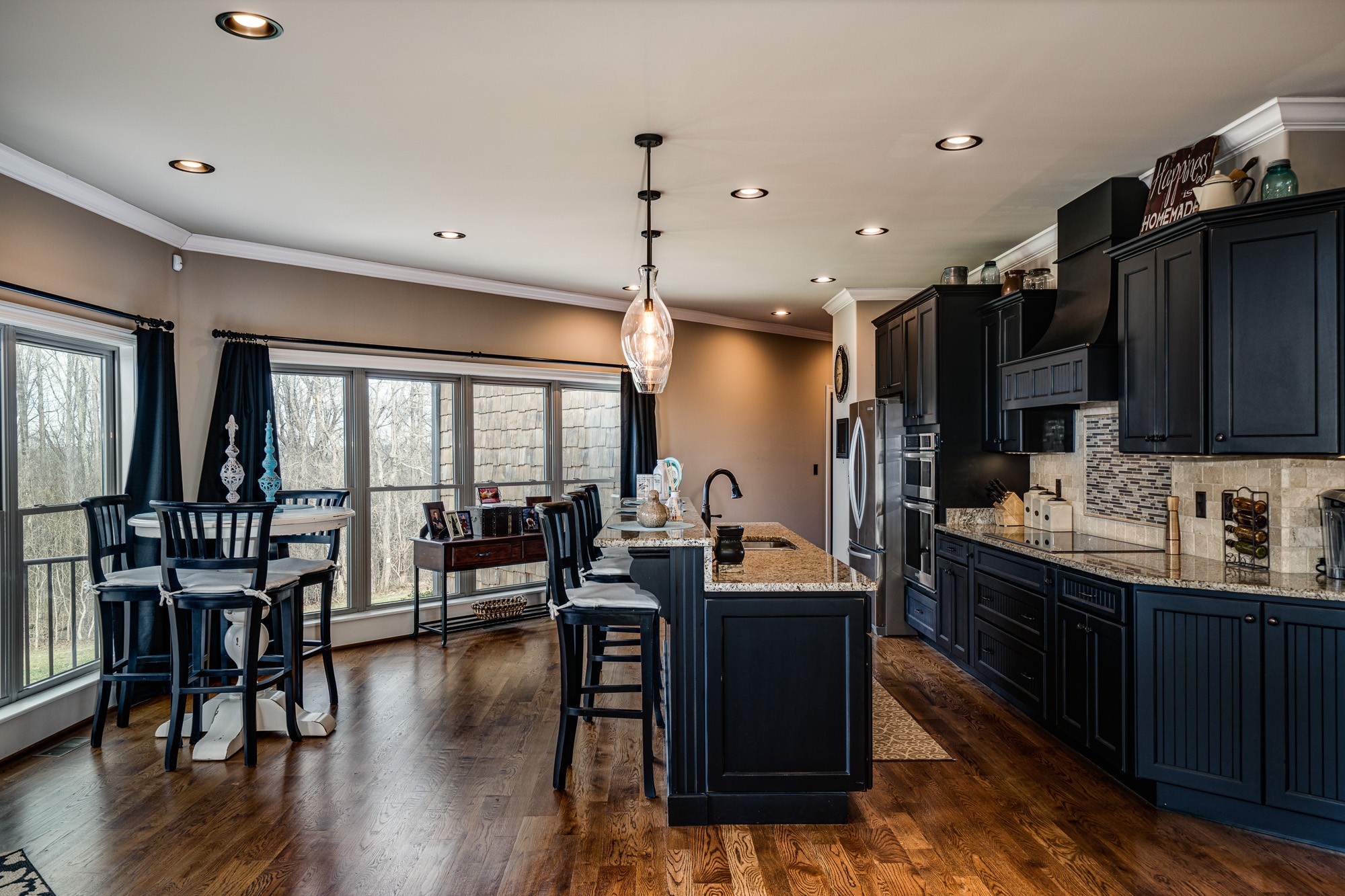 3639 Swan Ridge Road Celina, TN 38551 - Photo 7 of 37 a kitchen with counter top space a sink appliances and cabinets