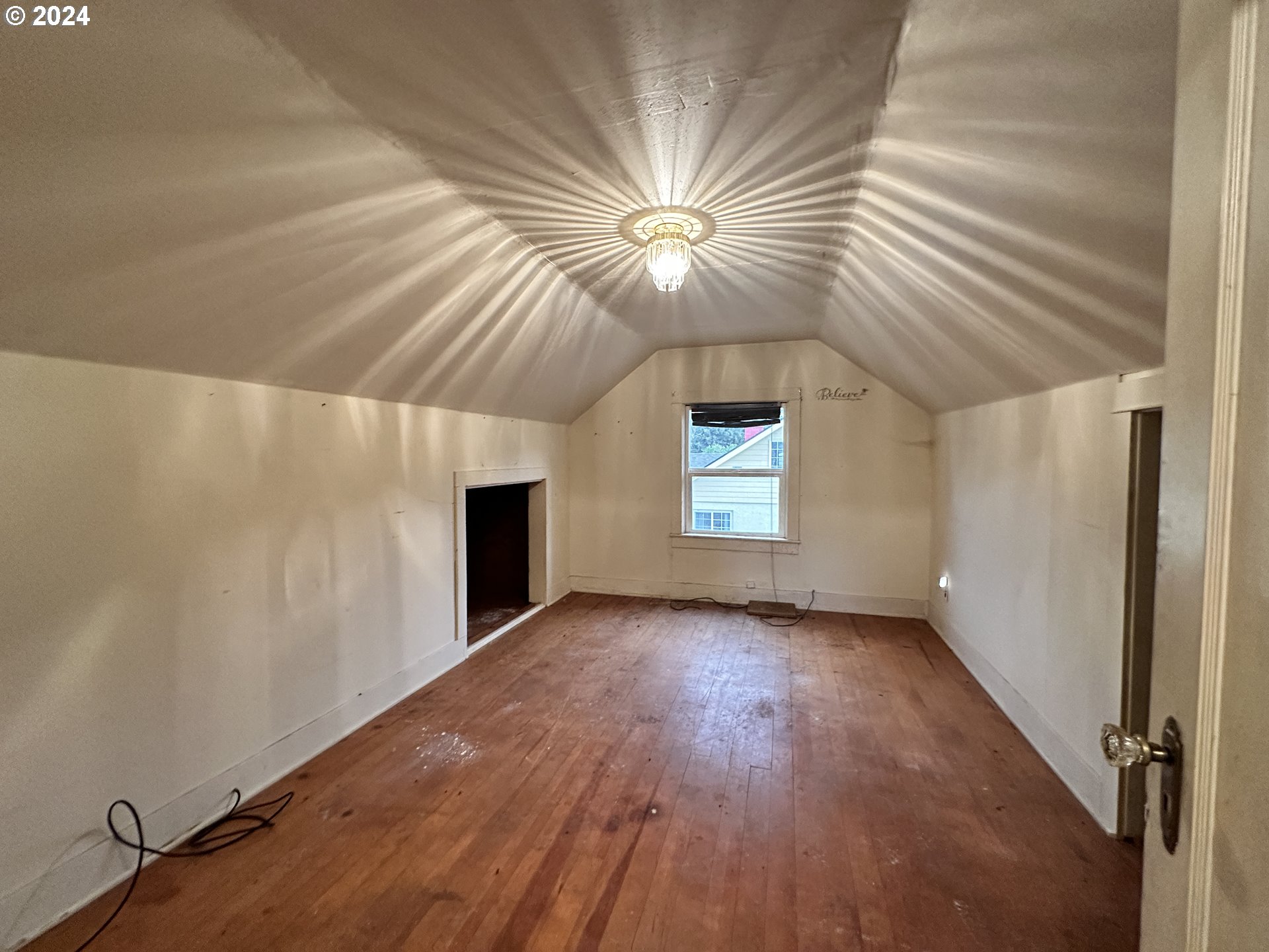 1175 Washington Street Fossil, OR 97830 - Photo 13 of 14 wooden floor in an empty room with a window