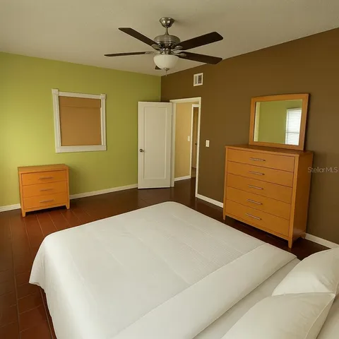a bedroom with a bed and a dresser