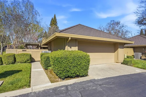 a front view of a house with a garage