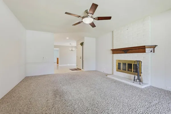a view of an entryway with floor to ceiling window and outdoor space