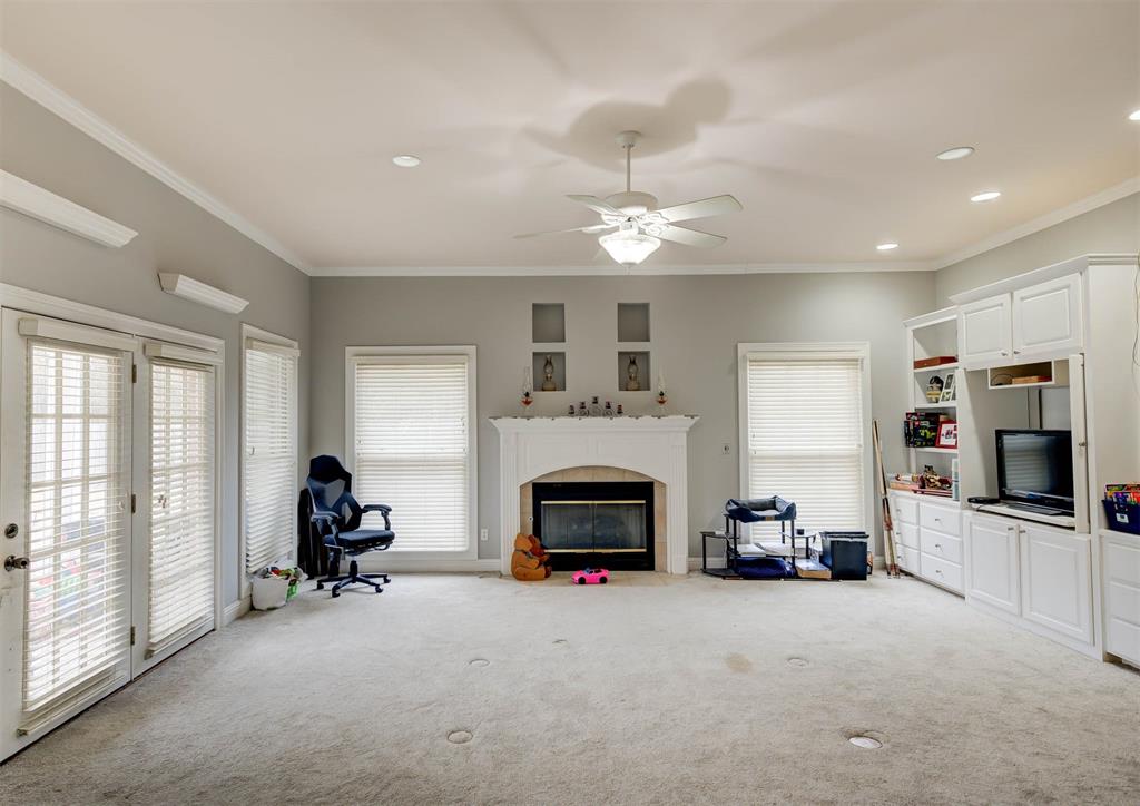 6817 North Club Loop Shreveport, LA 71107 - Photo 5 of 18 a living room with furniture a fireplace and a flat screen tv