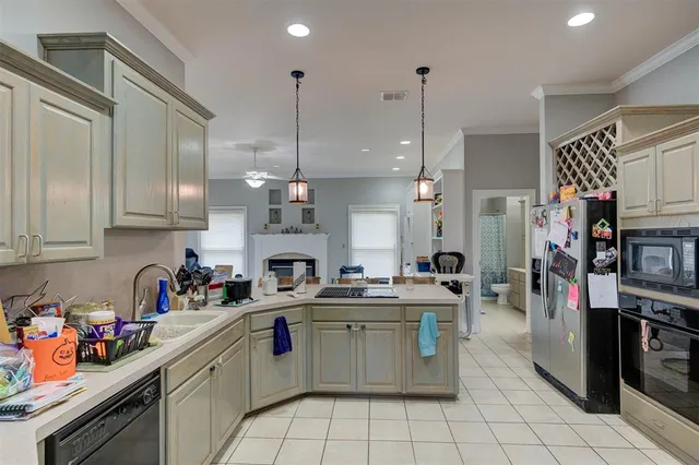 a kitchen with a sink cabinets and window