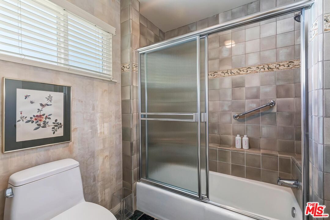 17171 Palisades Circle Pacific Palisades, CA 90272 - Photo 18 of 29 a bathroom with a shower and toilet