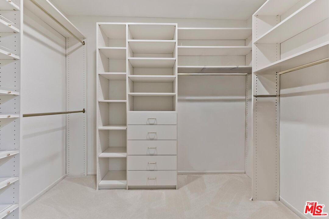 17171 Palisades Circle Pacific Palisades, CA 90272 - Photo 19 of 29 a view of an empty walk in closet