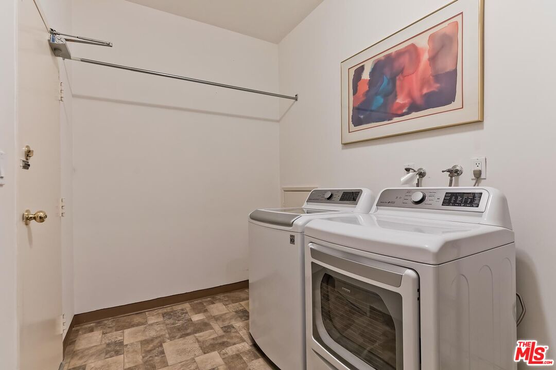 17171 Palisades Circle Pacific Palisades, CA 90272 - Photo 23 of 29 a utility room with dryer and washer