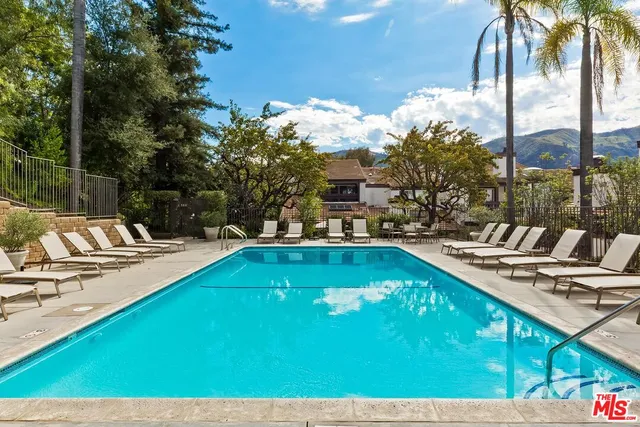 a view of a swimming pool with a patio