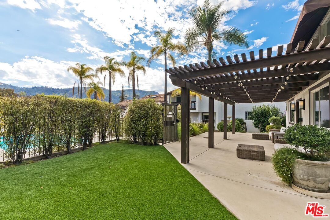 17171 Palisades Circle Pacific Palisades, CA 90272 - Photo 27 of 29 a view of a porch with a backyard